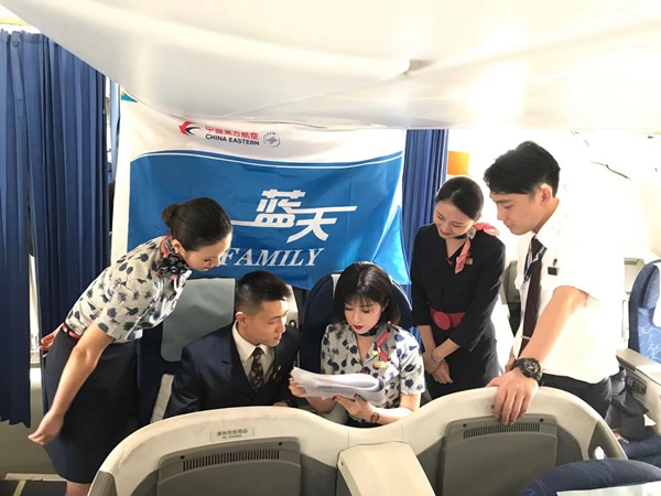 Flight Attendant Escorts Overseas Chinese on Return Home