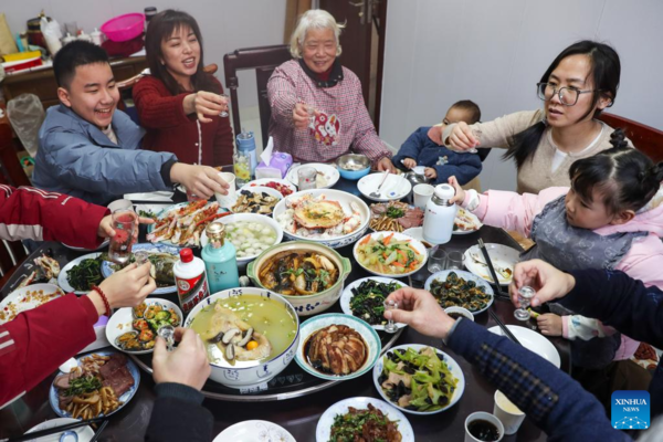 People Across China Have Family Reunion Dinners on Chinese Lunar New Year's Eve