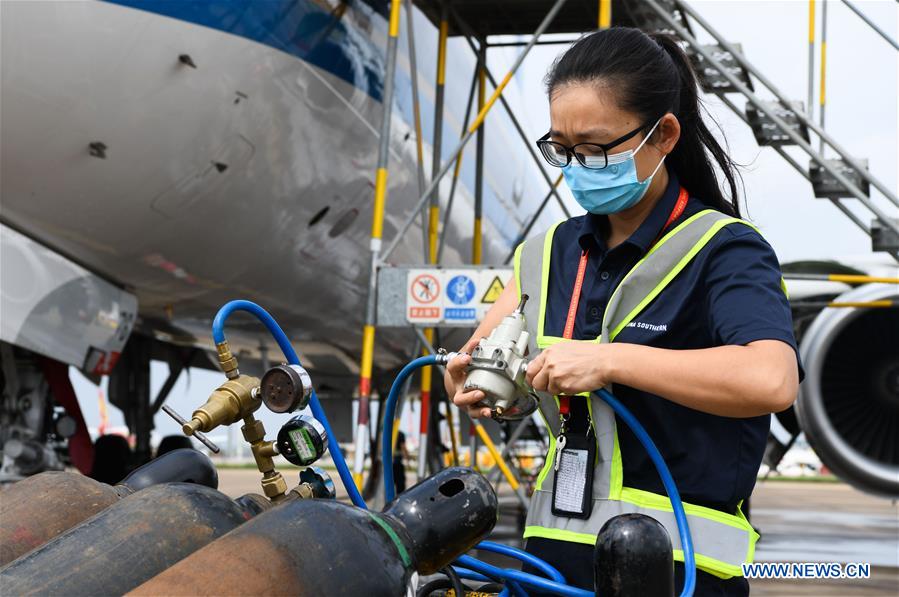 Female Maintenance Engineer Works at Haikou Int'l Airport