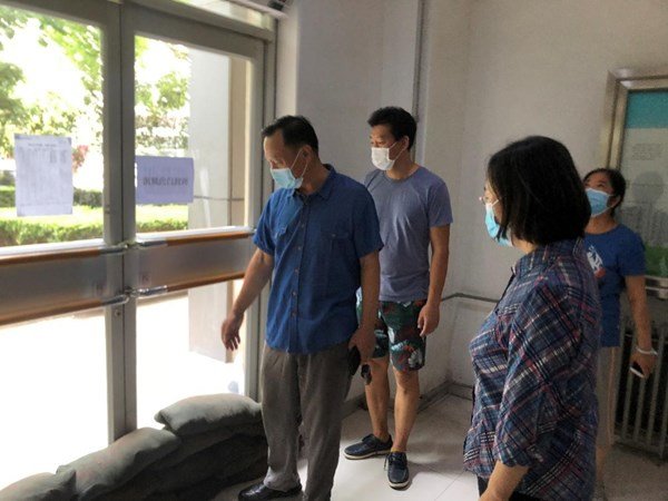 CWU Leaders Inspect School's Flood Prevention Measures