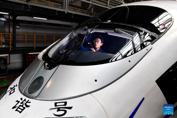 Young Mechanists at Jinan Bullet Train Service Station Maintain Trains for Safe Operation