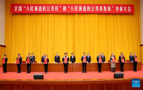 Xi Meets Model Civil Servants