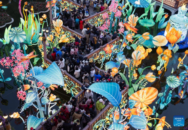 People Watch Lantern Show at Yu Garden in Shanghai