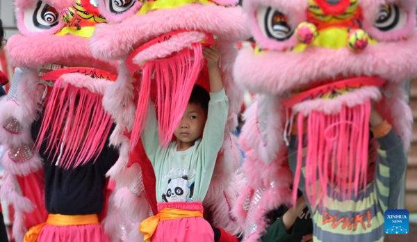 Lion Dance Integrated with School Education in Tengxian, S China