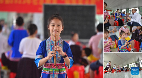 Students Learn About Intangible Cultural Heritages in Summer Vacation in Guangxi, S China