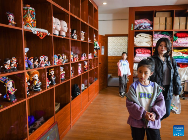 Handmade Dolls Bring Fortunes to Local Residents in SW China's County