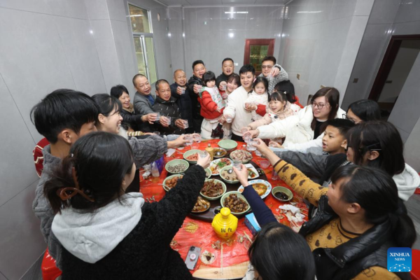 People Across China Have Family Reunion Dinners on Chinese Lunar New Year's Eve