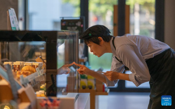 Deaf Barista's Love Brews in a Cup of Coffee