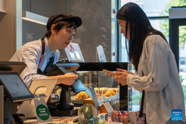 Deaf Barista's Love Brews in a Cup of Coffee