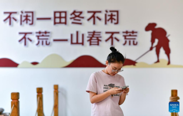 Young Village Worker Helps Villagers Develop Rice Seed Production Industry in SW China