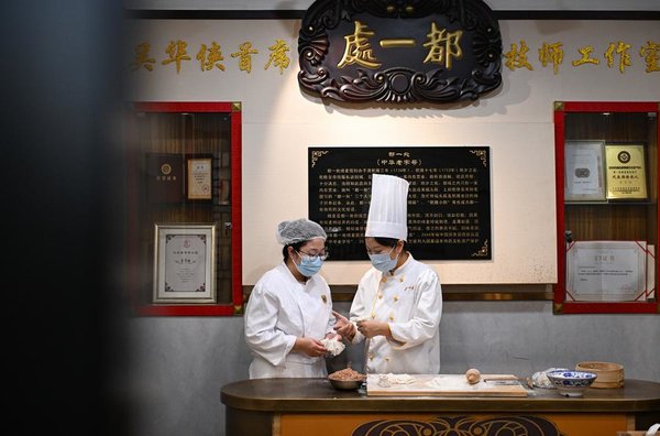 From Shaomai Chef to NPC Deputy: Serving People with Passion, Dedication