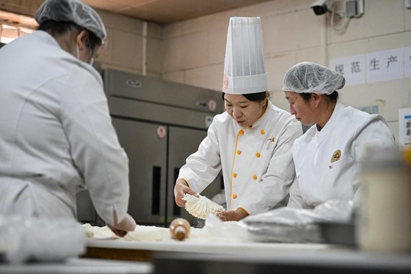 From Shaomai Chef to NPC Deputy: Serving People with Passion, Dedication